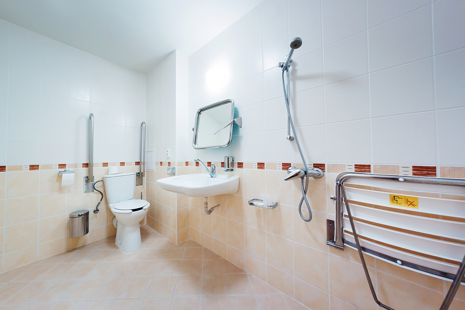 Half height shower doors - Bathroom with grab bars for people with disabilities